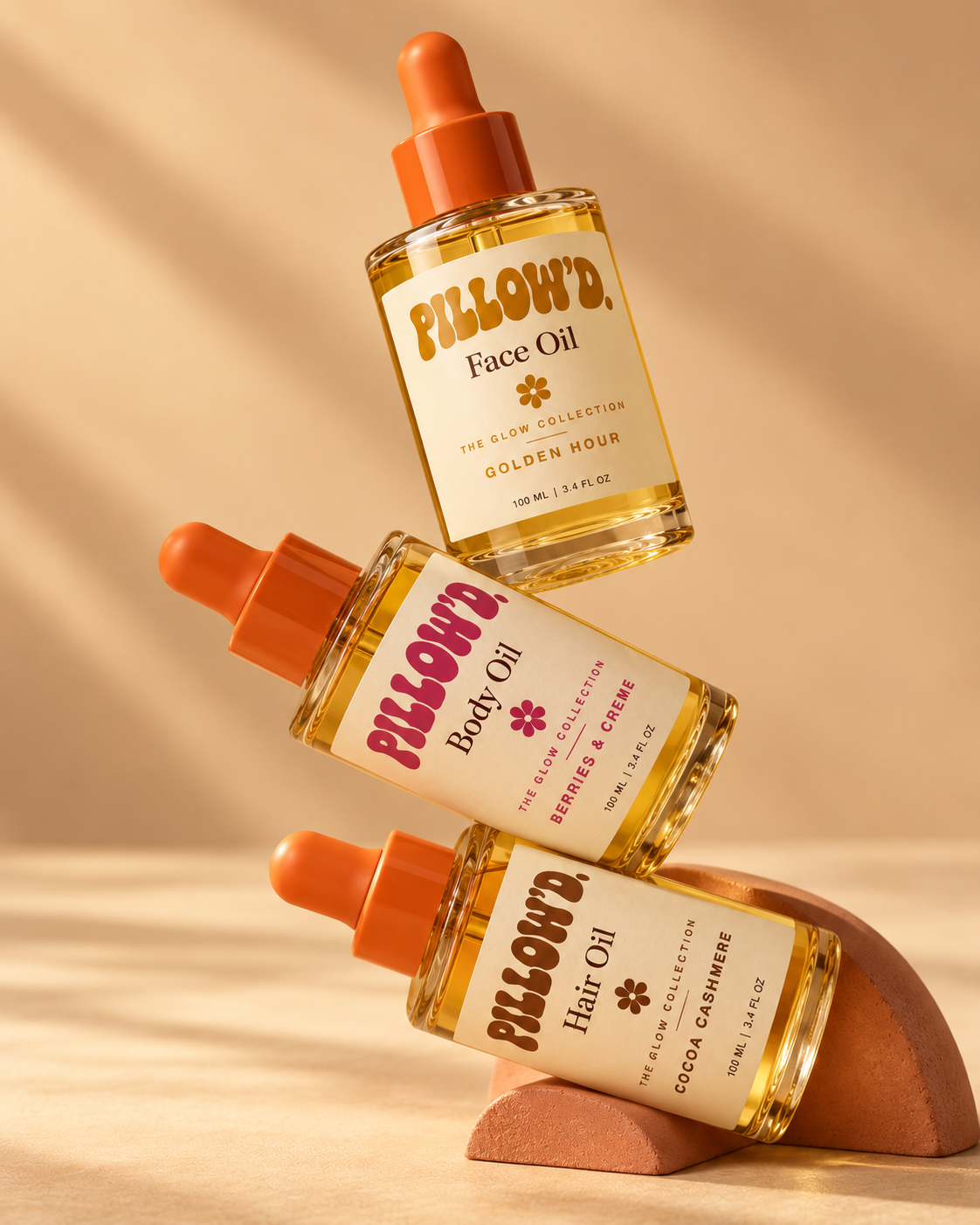 Three Pillow'd oil bottles stacked on a terracotta arch